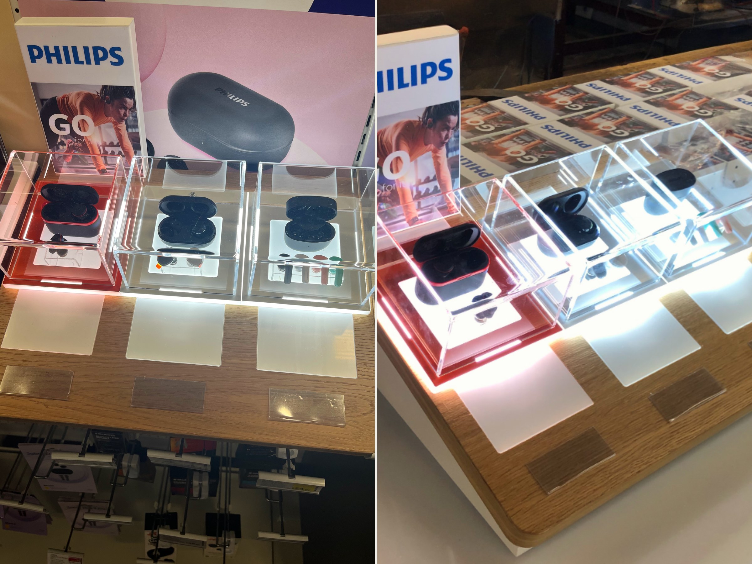 Philips Go wireless earbuds countertop display for Currys showing in-store presentation and workshop build with acrylic display cases, oak base and illuminated product bays